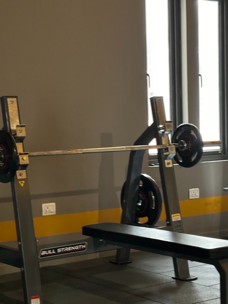 Olympic Flat Bench Press Station for chest workouts at Desh Gym