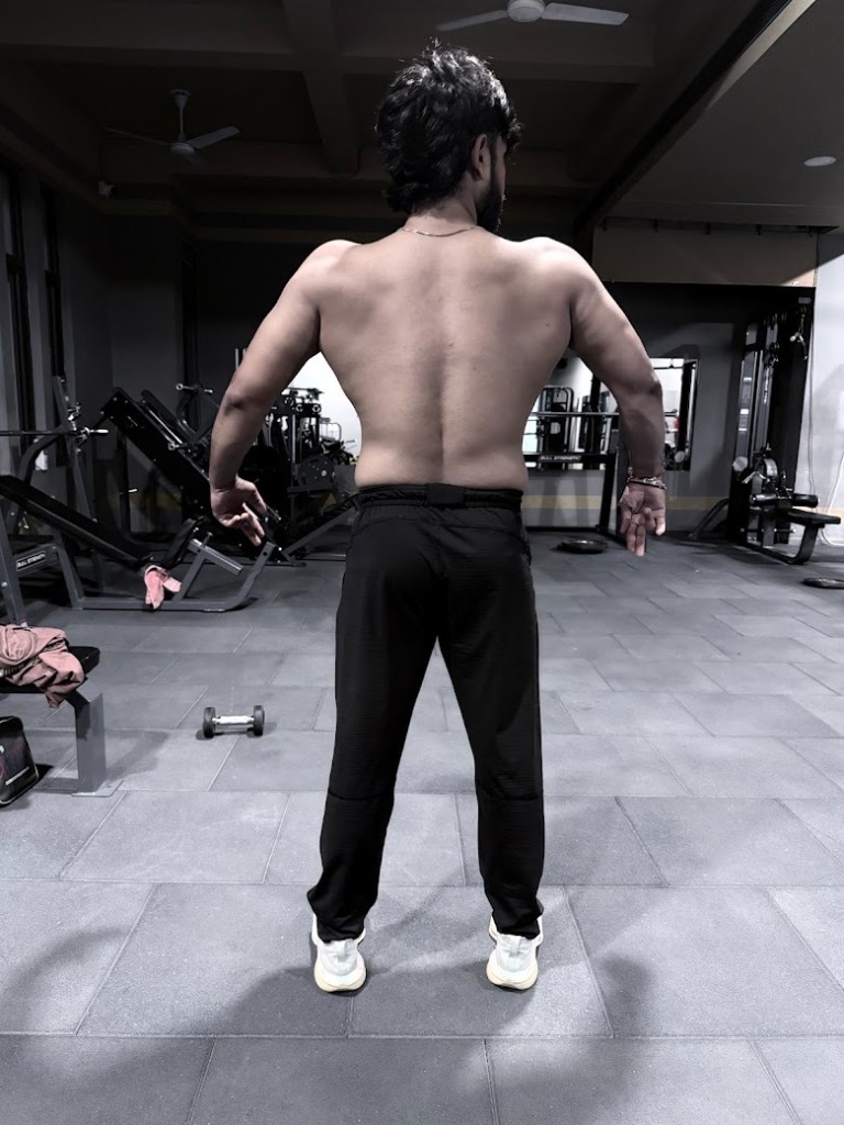 Certified Gym Trainer Physique showing Back Muscles at Desh Gym Dehgam